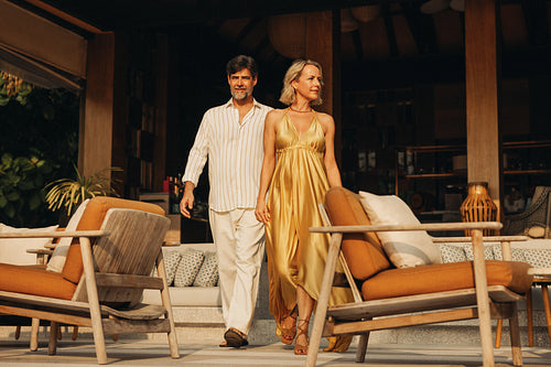 Couple at luxury resort restaurant during tropical holiday