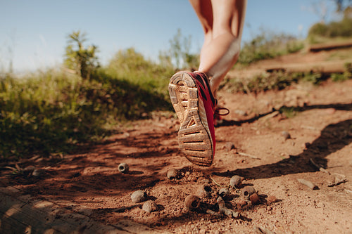 Cropped shot of an athlete walking on a mud trail path