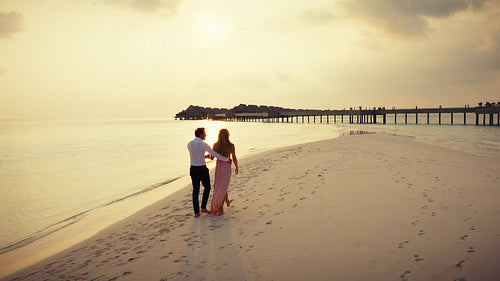 Luxury vacation for a couple enjoying the golden hour at a tropical island resort