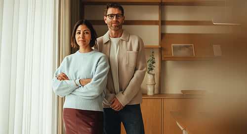 Coworkers pose for a business portrait in a modern office