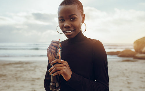 African woman on beach vacation