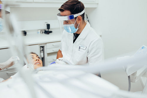 Dentist discussing treatment with patient