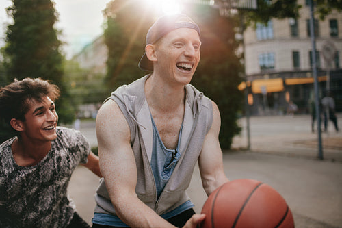 Friends playing basketball and having fun