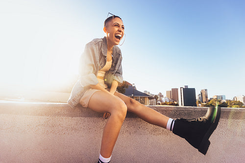 Young woman laughing in the sun