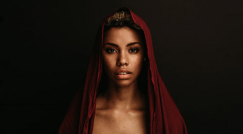 African american woman with traditional cloth over her head