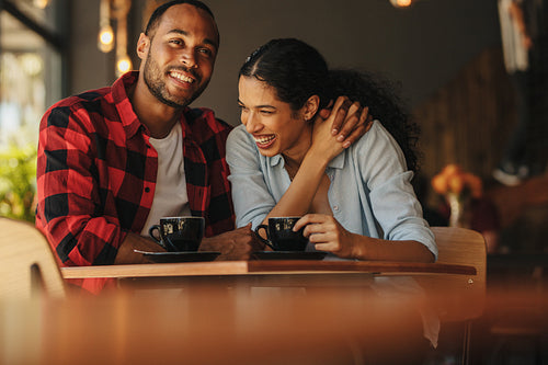 Couple in love on a date in a coffee shop