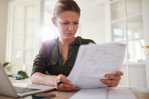 Woman busy working at home office