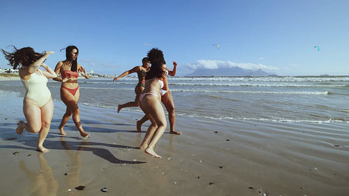Friends in their bikini bodies enjoying summer holidays