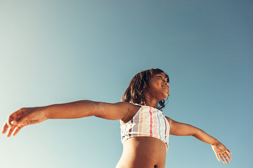 Little girl enjoying herself at the beach