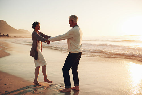 Romantic senior couple enjoying a day at the beach