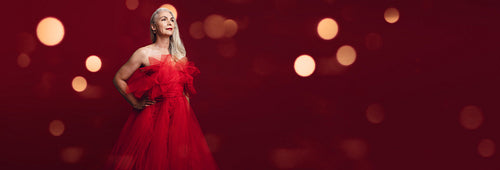 Attractive senior woman in a red gown