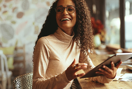 Smiling woman at a cafe