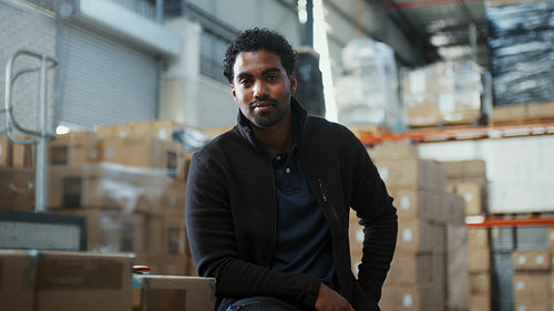 Next generation of logistics: Young male employee working in a fulfilment centre