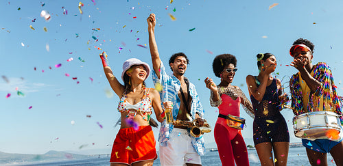 Celebration on the beach with music and confetti