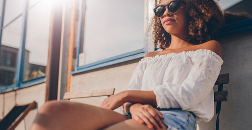 Young african woman relaxing outdoors
