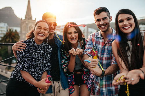 Friends hanging out together on rooftop party