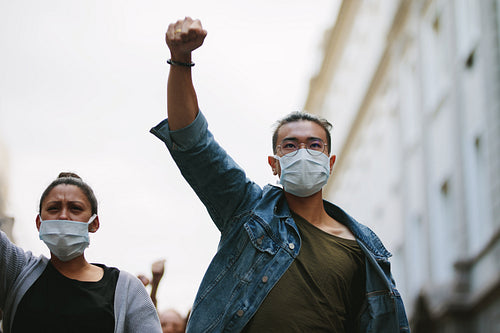 People protesting and giving slogans in a rally