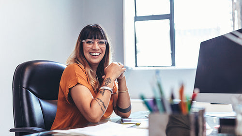 Illustrator sitting at her desk in office