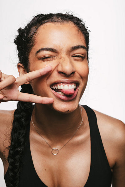 Happy female athlete making faces
