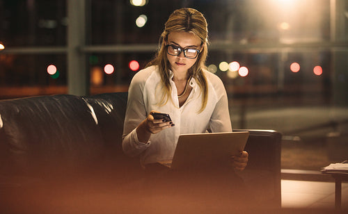 Woman working late in office