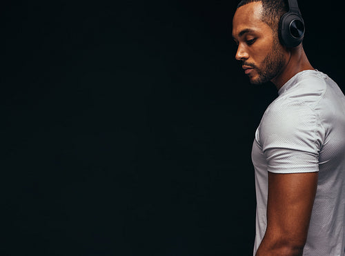 Portrait of african american man listening to music
