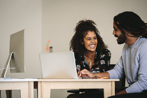 Business colleagues working together in office.