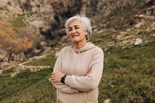 Carefree senior woman smiling happily outdoors