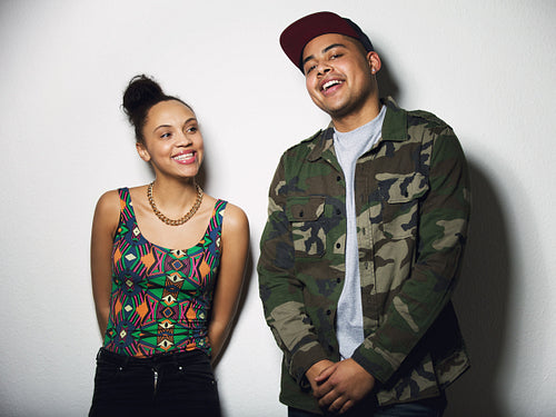 Cheerful young male and female models smiling
