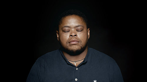 African man with closed eyes