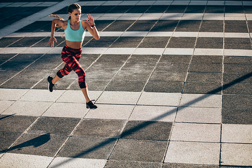 Woman doing morning workout in city