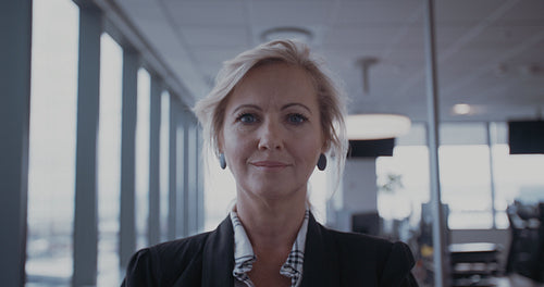 Confident mature businesswoman in office
