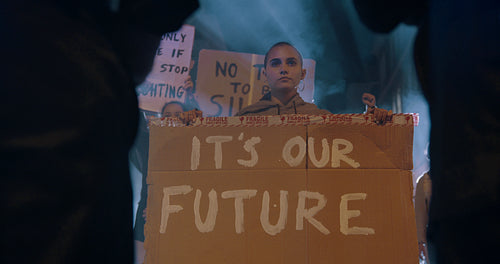Activists with poster demonstrating against the police force
