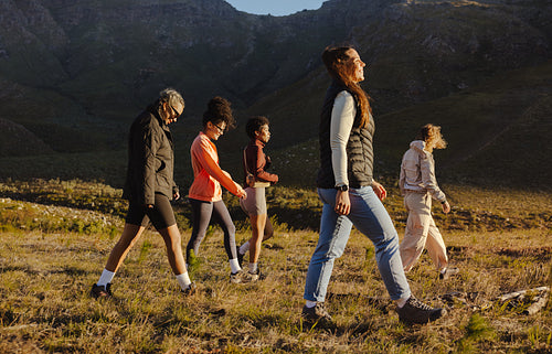Group hiking in scenic mountain area