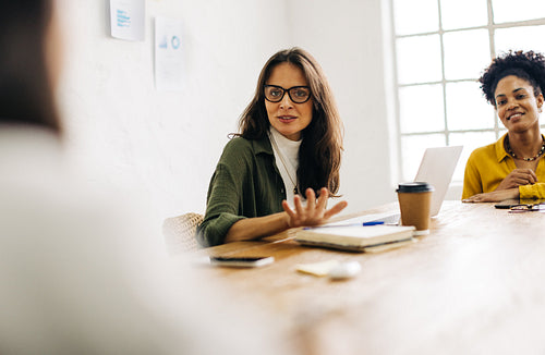 Female entrepreneurs discussing project ideas in a meeting