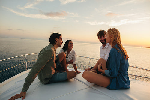 Friends on a holiday sitting on a yacht