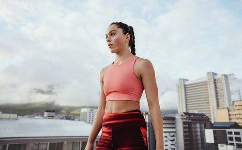 Fitness woman working out on rooftop