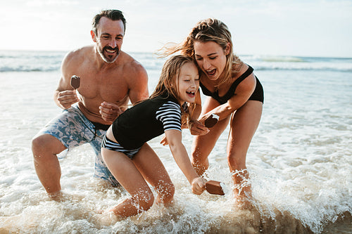 Family enjoying beach summer vacation