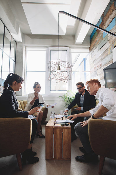 Creative people having meeting in modern office