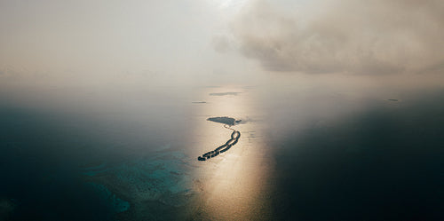 Aerial drone view of tropical Maldives with coral reefs and stunning beach islands