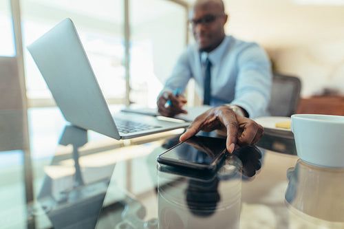 Businessman sitting at his desk in office