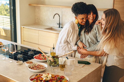 A woman joyfully shares her pregnancy announcement with her close friends