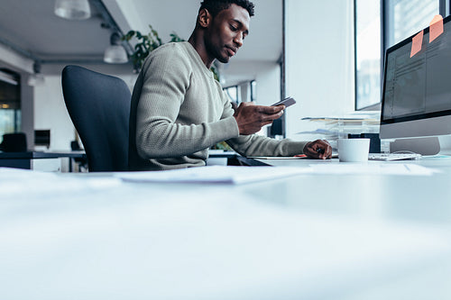 African man using smart phone