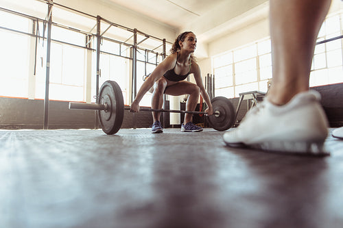 Muscular woman lifting weights