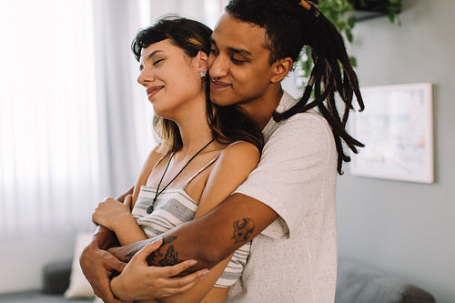 Adorable lovers bonding indoors
