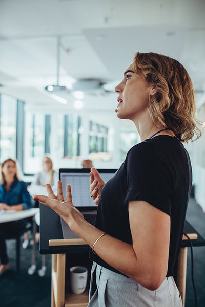 Entrepreneur giving a presentation to group of professionals