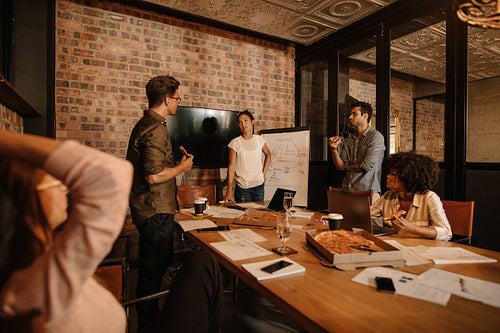 Office workers discussing new business strategy