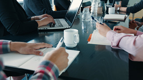 Business people applauding in a meeting, celebrating success on a project