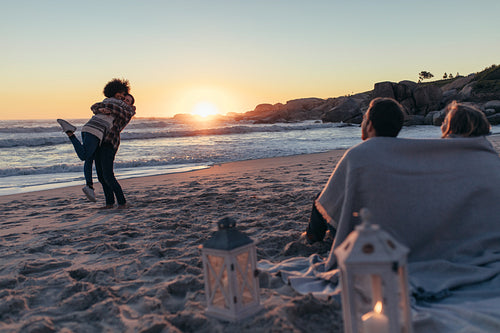 Couple in love hugging at the beach