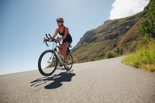 Woman competing in the cycling leg of a triathlon