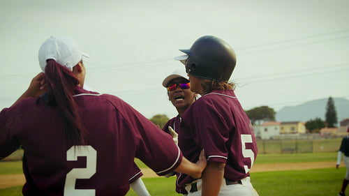 Women's baseball team celebrates victory on the field